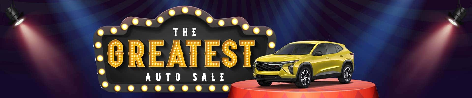 Yellow car on a red platform under spotlights, with "The Greatest Auto Sale" sign in the background.