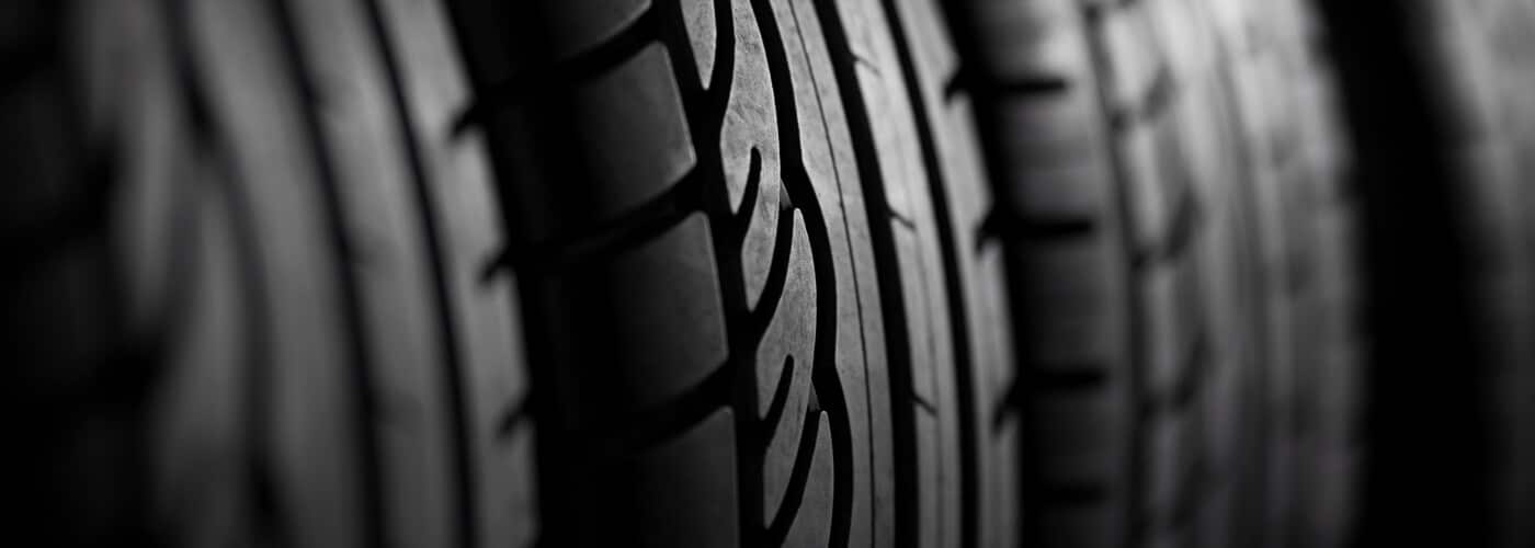 Close-up of tire treads with intricate patterns, highlighting texture and design.